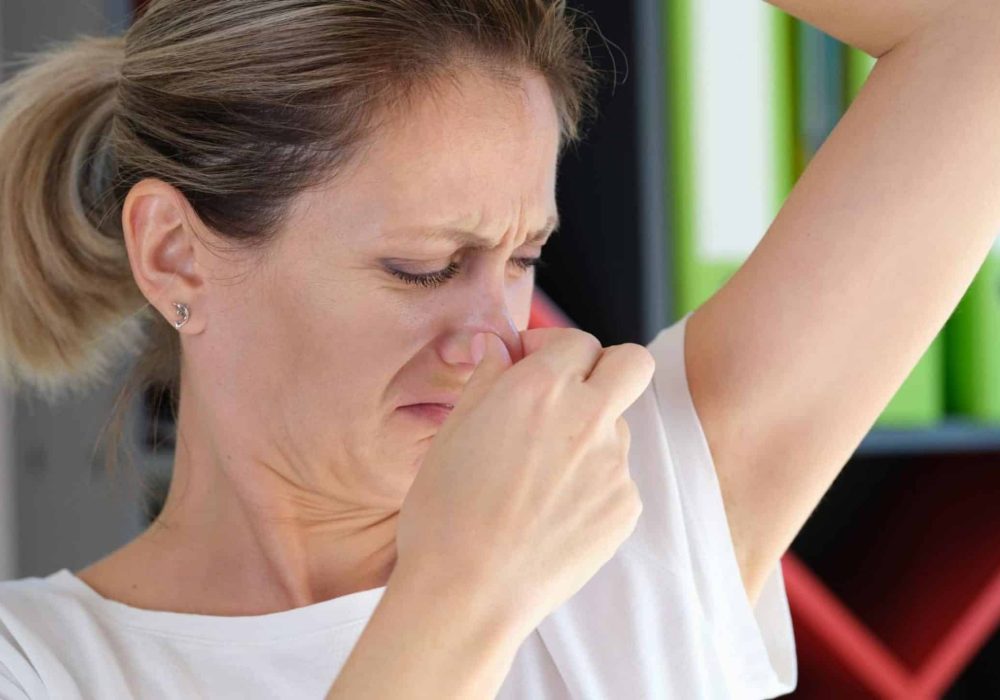 unhappy-woman-smells-her-armpit-close-up-unpleasant-smell-armpit-health-problem